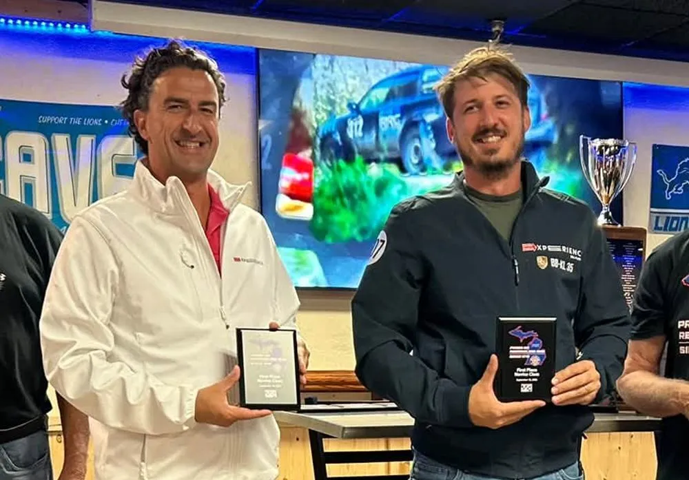 Erick Mahle (right) and his co-driver holding their Novice class awards at Press On Regardless 2026